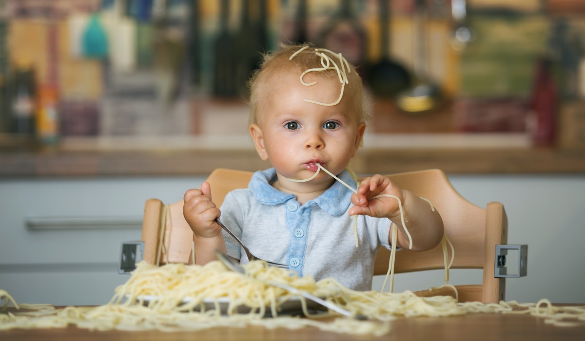 italian baby eating pasta